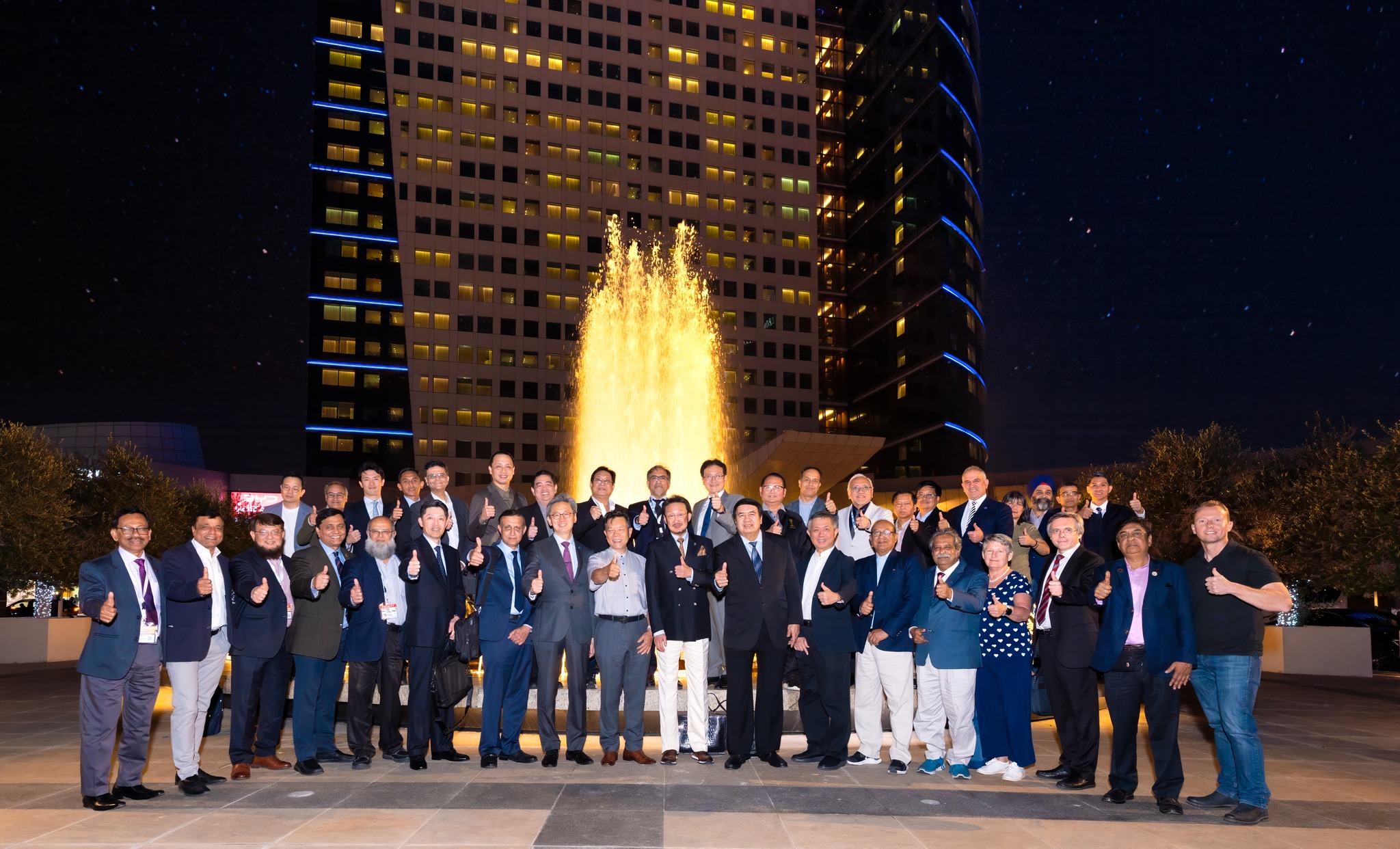 Group photo 2024 APOA Council at the 23rd APOA Congress in front of the fountain at Dubai Festival City