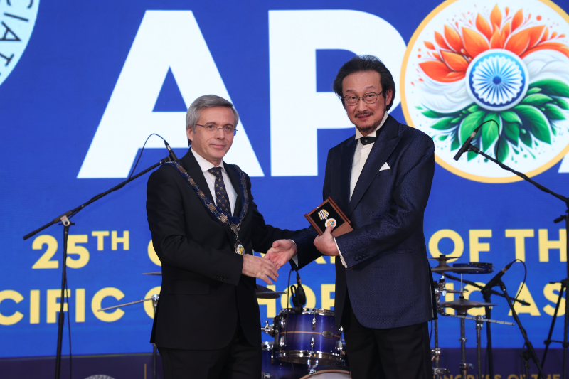 Incoming president Onder Aydingoz and outgoing president Nicolaas Budhiparama